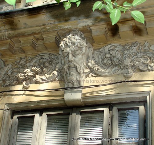 Mascaron adorning the window of a "Little Paris" style house, Bucharest