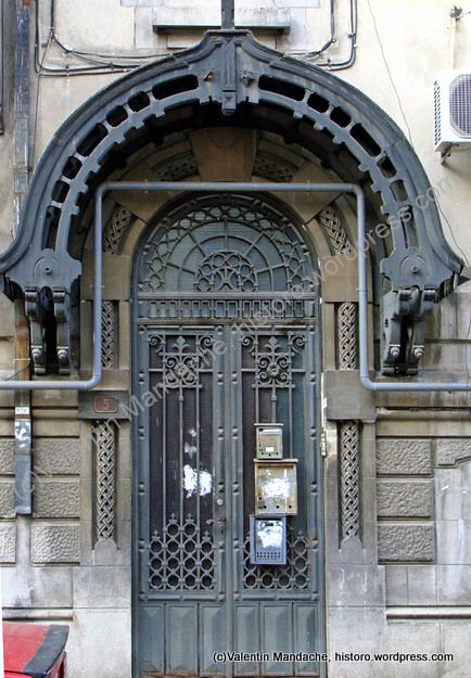 Late 1920s Neo-Romanian style doorway and contemporary gas-pipe, Bucharest